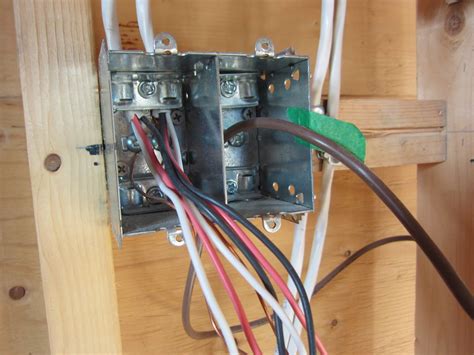 cl2 and 120v cable in same junction box|separating high and low voltage in same box.